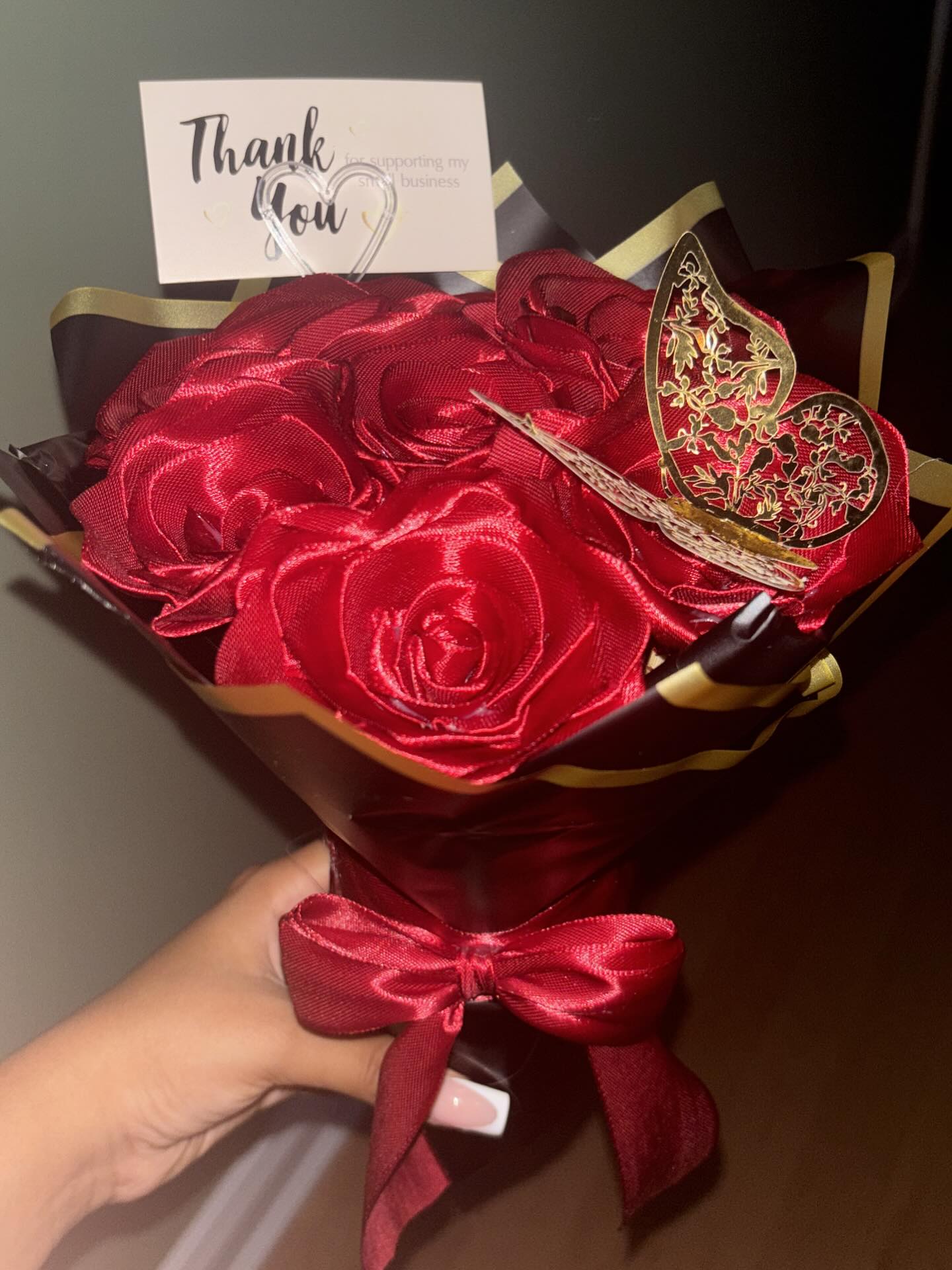 Red ribbon bouquet with gold butterfly and thank you card